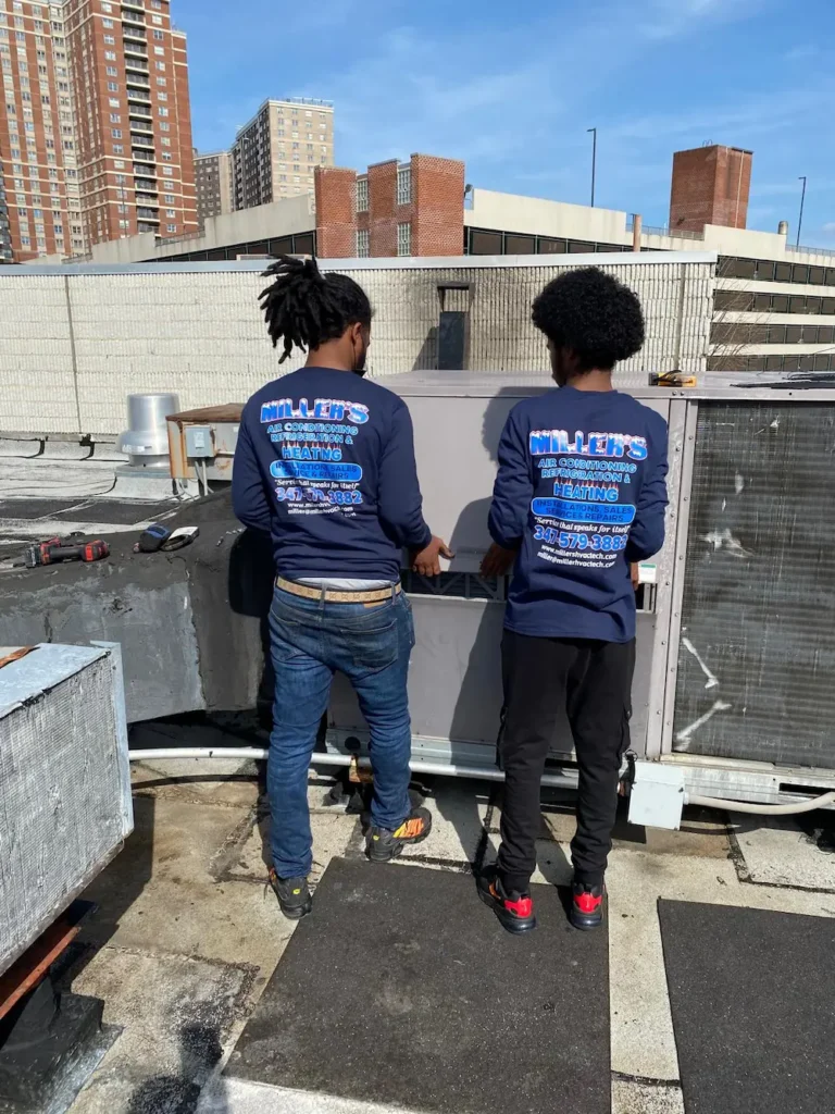 techs-working-on-exterior-refrigeration-unit (1) Technicians working on exterior refrigeration unit