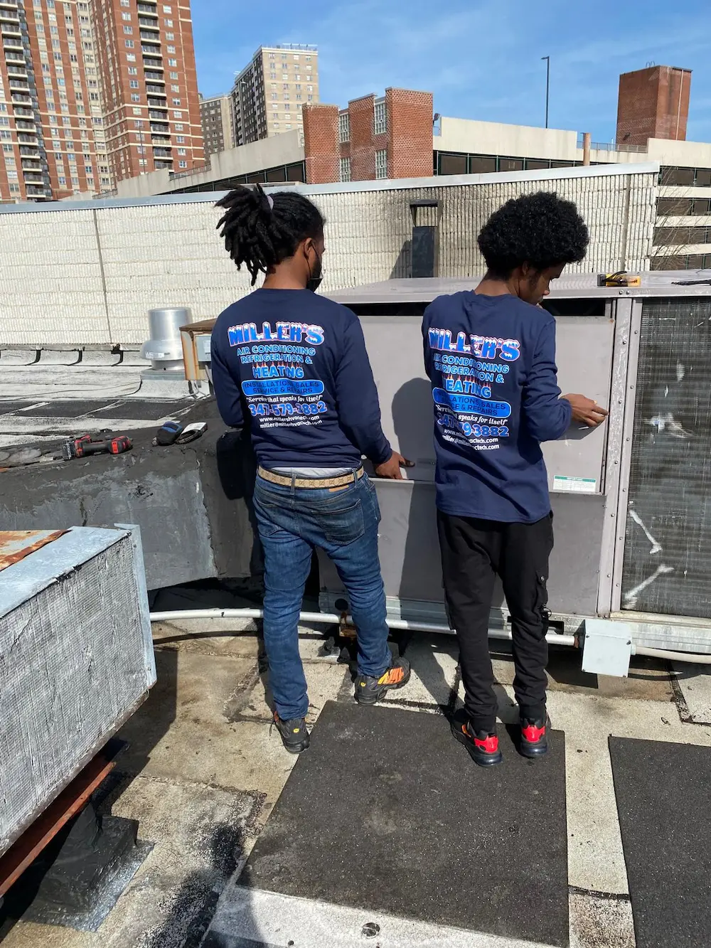 techs-working-on-exterior-refrigeration-unit (2) Technicians working on exterior refrigeration unit